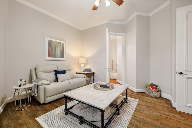 living room featuring crown molding, hardwood / wood-style floors, and ceiling fan