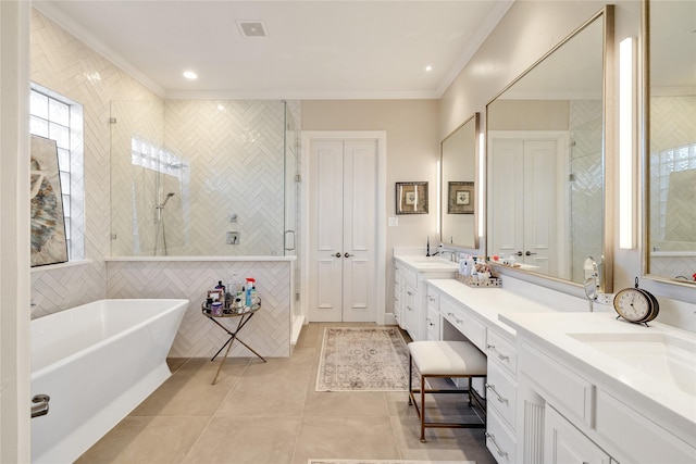 bathroom featuring tile patterned flooring, tile walls, vanity, ornamental molding, and plus walk in shower