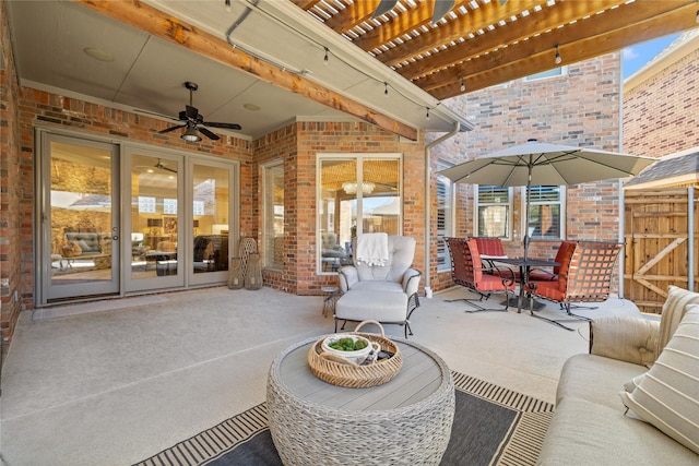 view of patio with ceiling fan, an outdoor living space, and a pergola