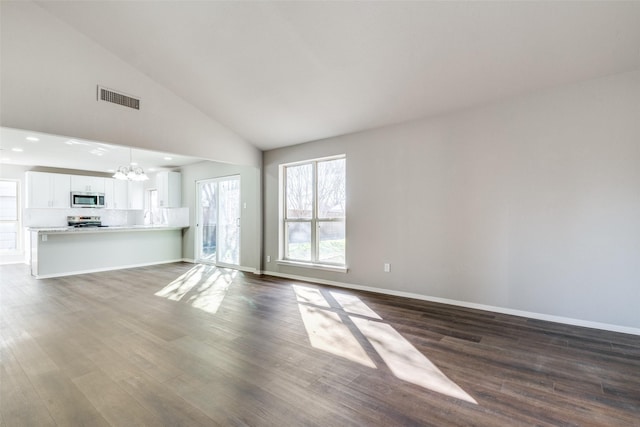 unfurnished living room featuring high vaulted ceiling, a notable chandelier, and dark hardwood / wood-style flooring