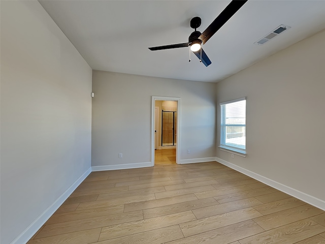 empty room featuring light hardwood / wood-style floors and ceiling fan