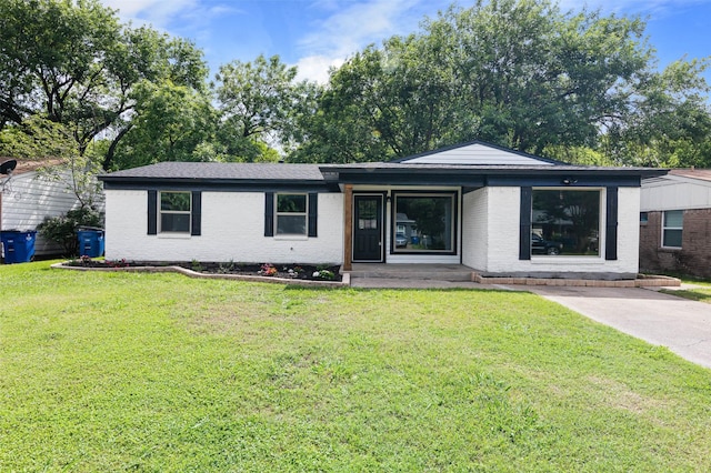 ranch-style house with a front yard