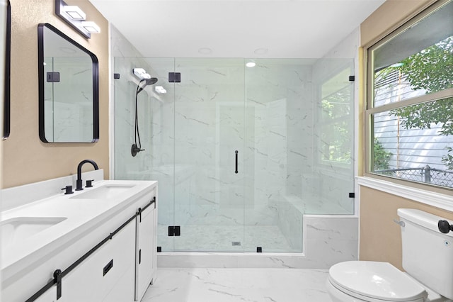 bathroom featuring vanity, toilet, and an enclosed shower