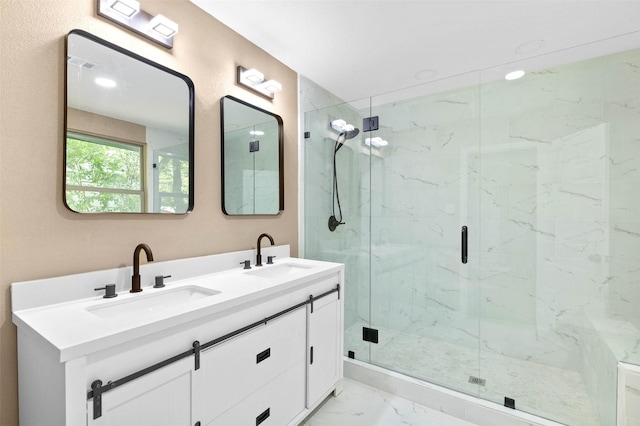 bathroom featuring walk in shower and vanity