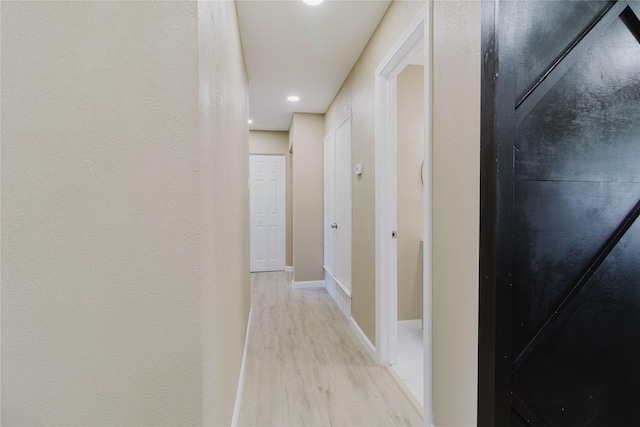 hallway featuring light hardwood / wood-style floors