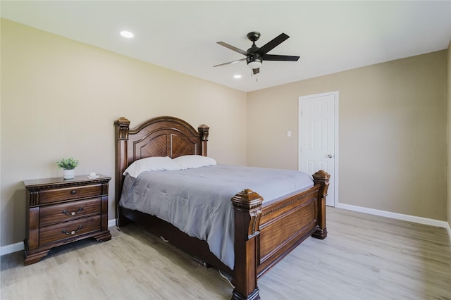 bedroom with ceiling fan and light wood-type flooring