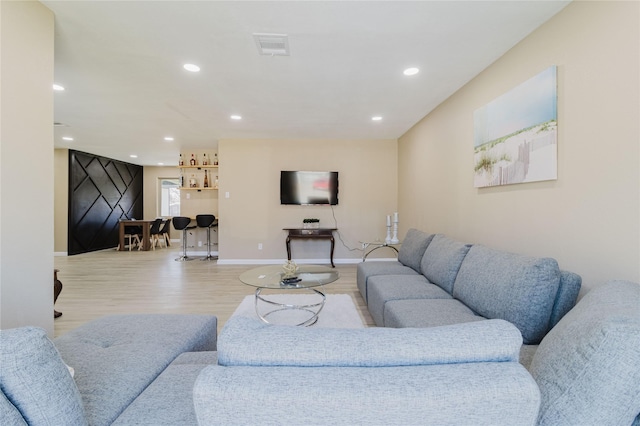 living room with light hardwood / wood-style floors