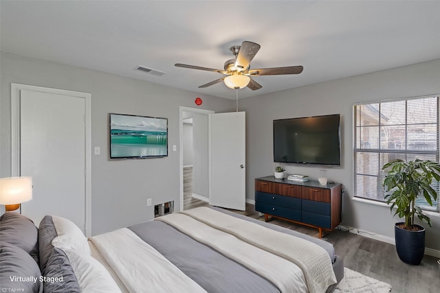 bedroom featuring ceiling fan and hardwood / wood-style floors