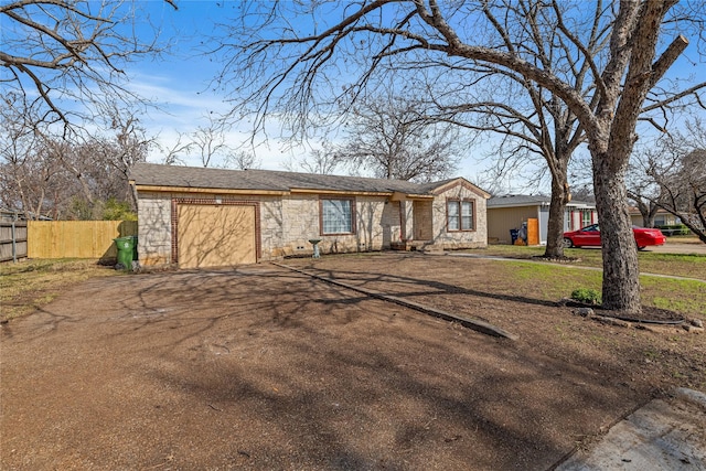 single story home with a garage