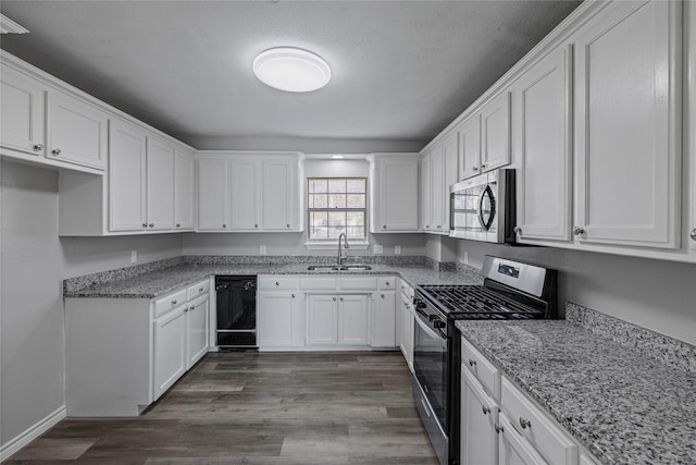 kitchen featuring stainless steel appliances, white cabinetry, sink, and dark hardwood / wood-style floors