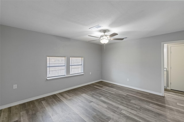 empty room featuring a textured ceiling, ceiling fan, and light hardwood / wood-style flooring