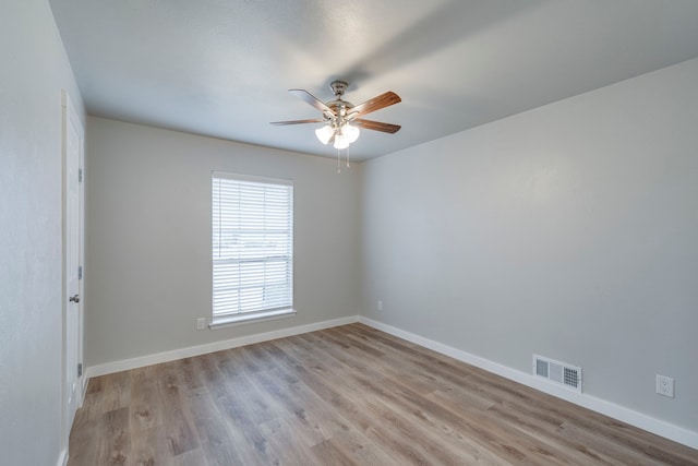 spare room featuring ceiling fan and light hardwood / wood-style flooring