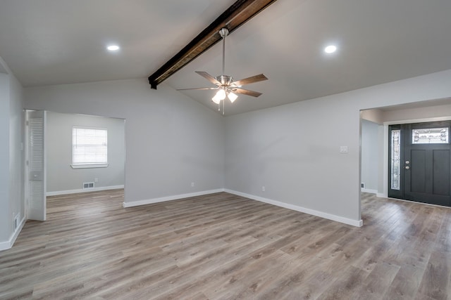 spare room with ceiling fan, light hardwood / wood-style floors, and lofted ceiling with beams