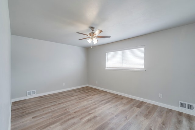 spare room with ceiling fan and light hardwood / wood-style floors