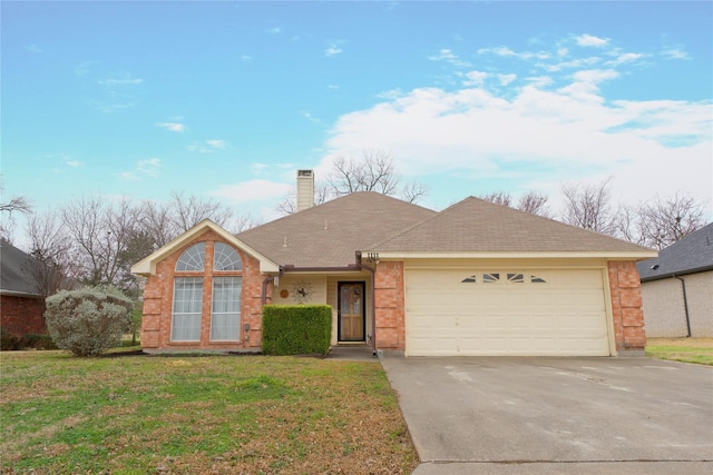 ranch-style house featuring a garage and a front yard