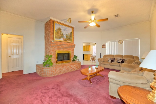 carpeted living room featuring a fireplace, ornamental molding, and ceiling fan