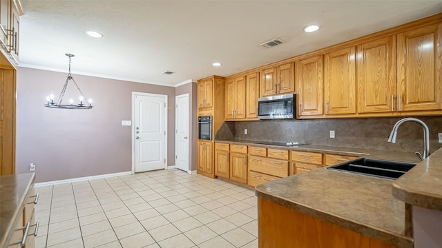 kitchen featuring pendant lighting, crown molding, sink, and black appliances