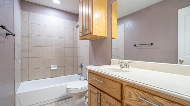 full bathroom with vanity, toilet, tiled shower / bath combo, and tile patterned flooring