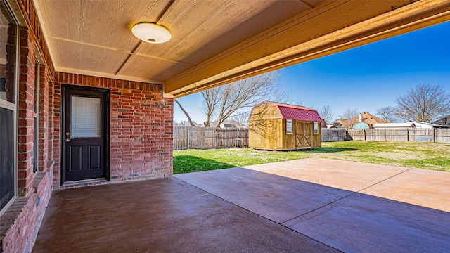 view of patio / terrace featuring a storage shed