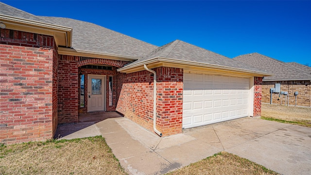 view of exterior entry with a garage