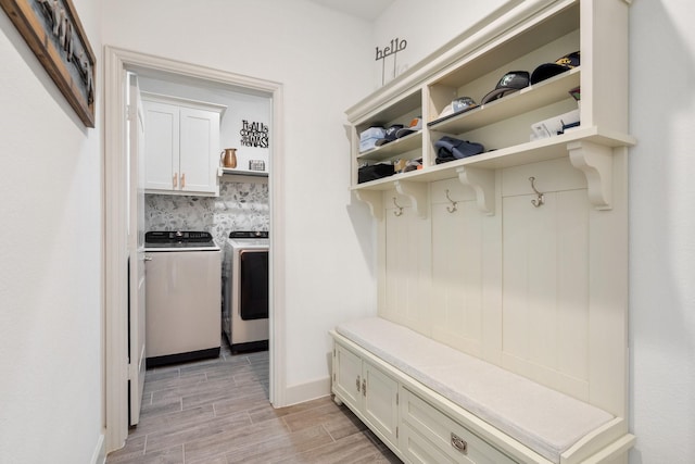 486 Colt Dr, Lavon, TX 75166 - mudroom featuring separate washer and dryer, light wood-style floors, and baseboards
