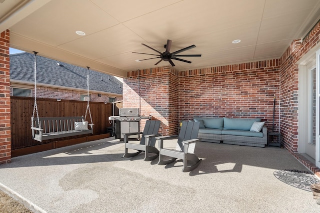 view of patio / terrace featuring area for grilling, ceiling fan, and fence