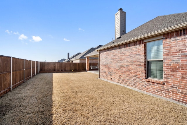 view of yard featuring a fenced backyard