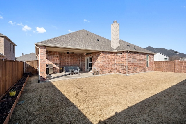 486 Colt Dr, Lavon, TX 75166 - back of property featuring brick siding, ceiling fan, a fenced backyard, a patio, and a shingled roof