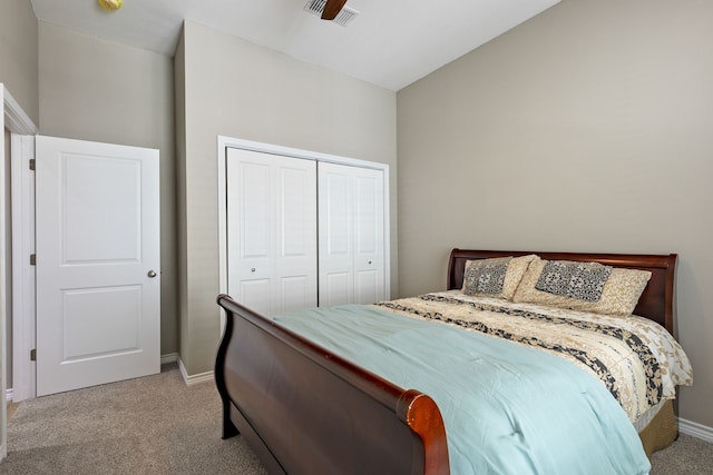 carpeted bedroom featuring a closet