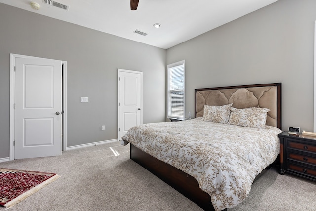 bedroom featuring light carpet and ceiling fan