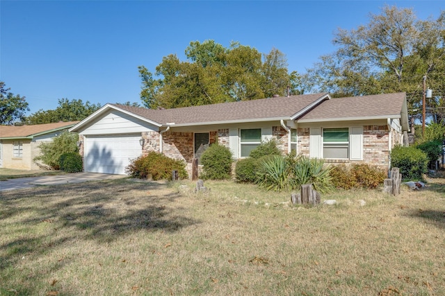 single story home featuring a garage and a front lawn