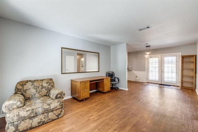 interior space featuring french doors and light hardwood / wood-style flooring