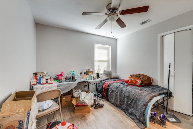 bedroom featuring hardwood / wood-style floors and ceiling fan