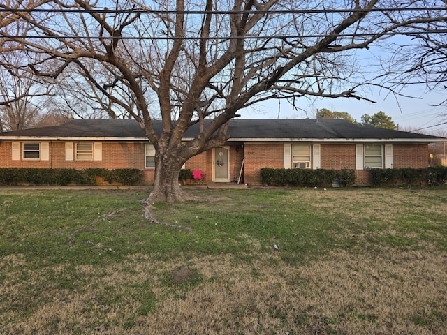 ranch-style house with a front yard