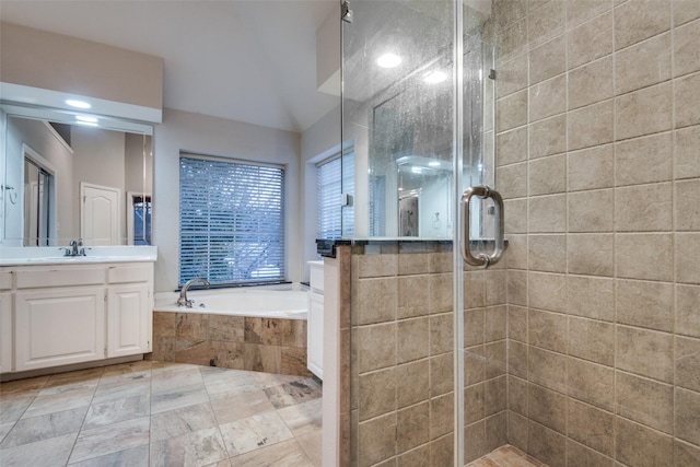 bathroom with plus walk in shower and vanity