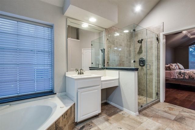 bathroom with vanity, plus walk in shower, and vaulted ceiling