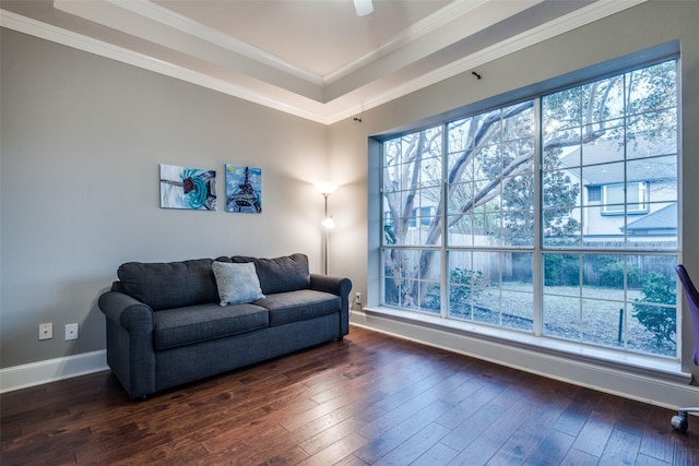 living room with ornamental molding and dark wood-type flooring