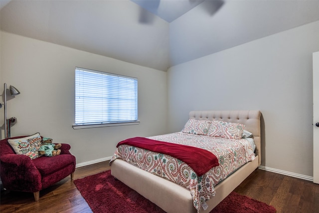 bedroom featuring lofted ceiling and dark wood-type flooring