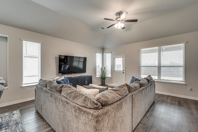 living room with ceiling fan, lofted ceiling, and dark hardwood / wood-style flooring