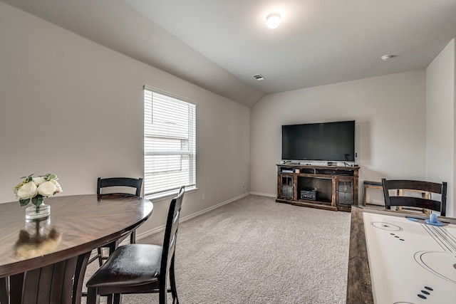 interior space featuring vaulted ceiling and carpet floors