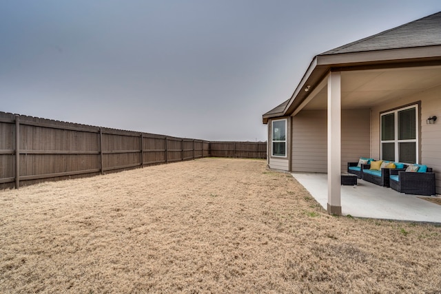 view of yard featuring a patio area and outdoor lounge area