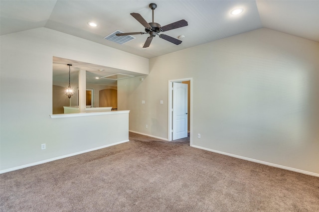 unfurnished living room with lofted ceiling, ceiling fan with notable chandelier, and carpet