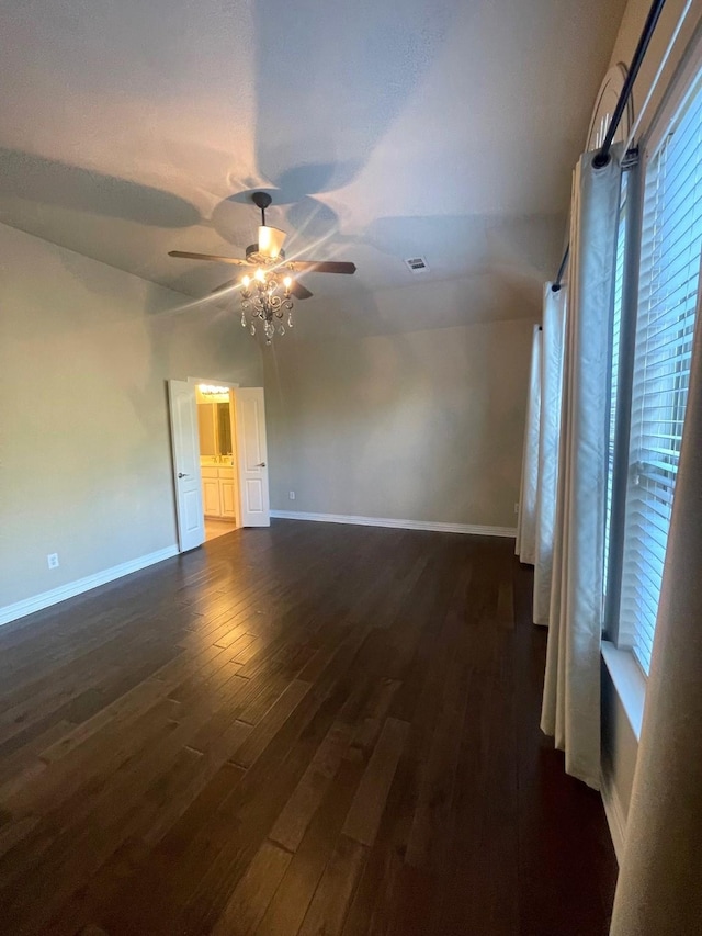 spare room featuring ceiling fan and dark hardwood / wood-style flooring