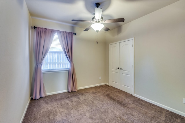 unfurnished bedroom with light colored carpet, a closet, and ceiling fan