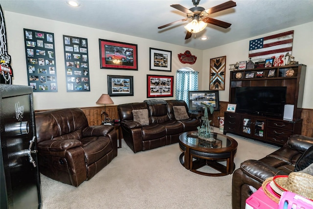 carpeted living room featuring ceiling fan