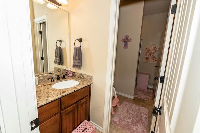 bathroom with tile patterned floors and vanity