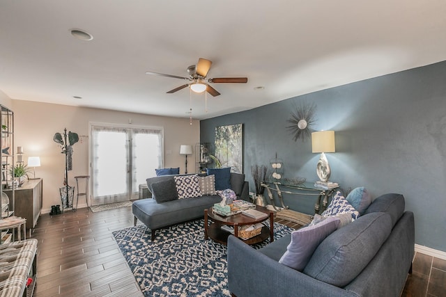 living room featuring dark hardwood / wood-style floors and ceiling fan