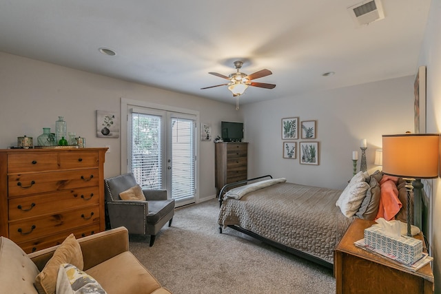 bedroom with light carpet, access to exterior, french doors, and ceiling fan