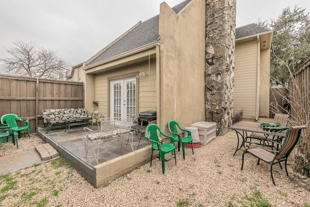 back of house with a patio