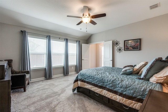 carpeted bedroom featuring lofted ceiling and ceiling fan